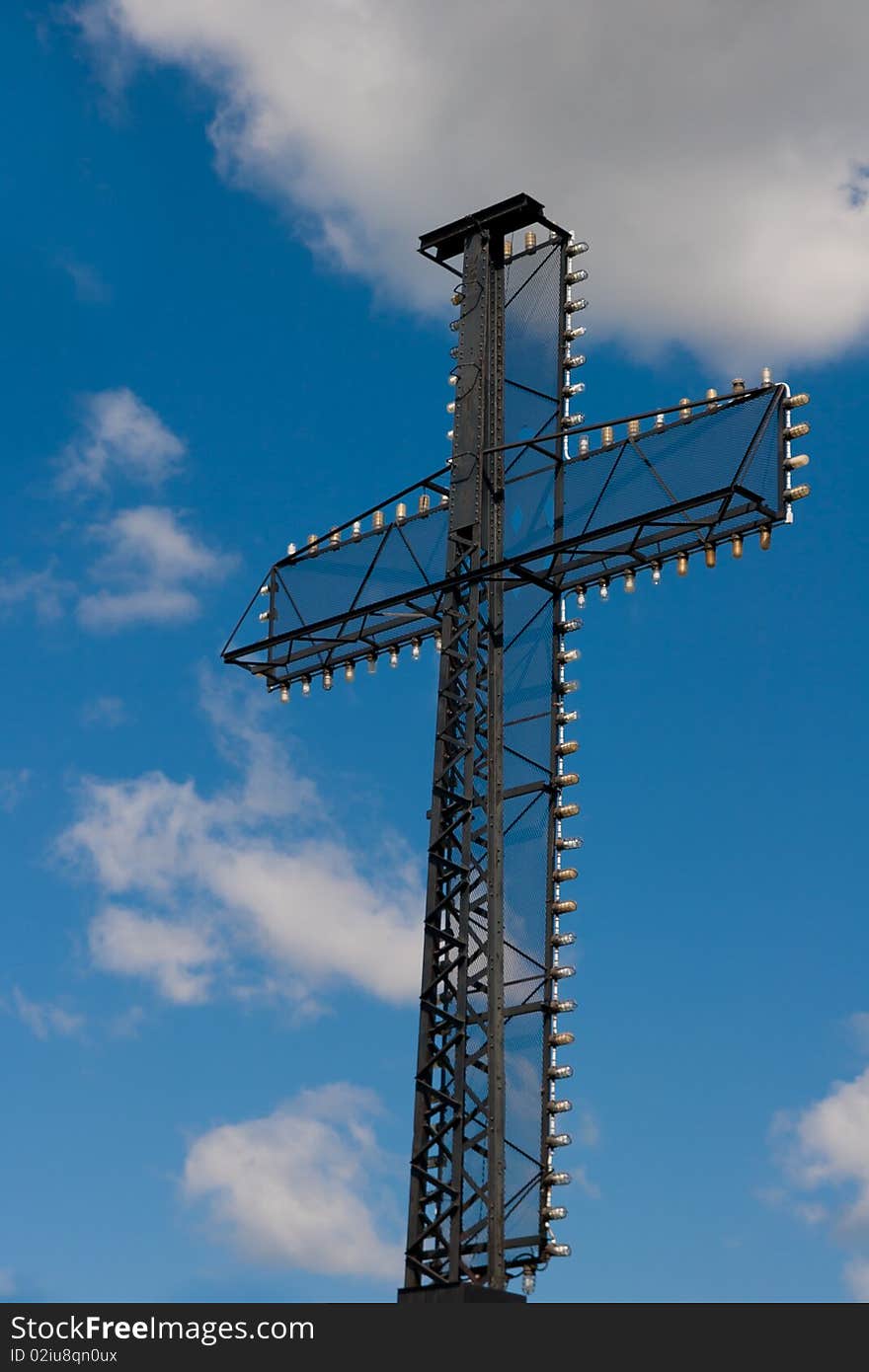 A black metal cross with lights.