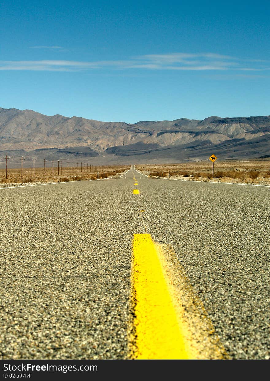 Desert road through Death Valley National Park