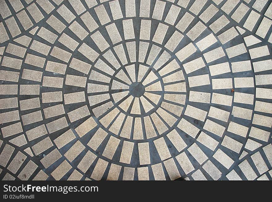 An abstract view of a round outdoor tiled floor.  . An abstract view of a round outdoor tiled floor.