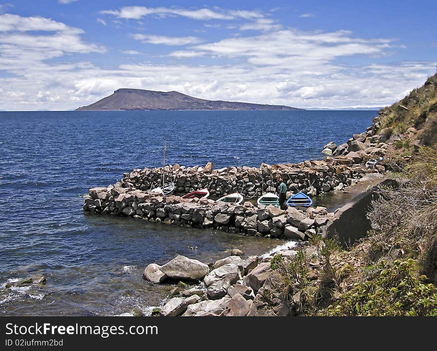 Small boat harbor by a Peruvian lake