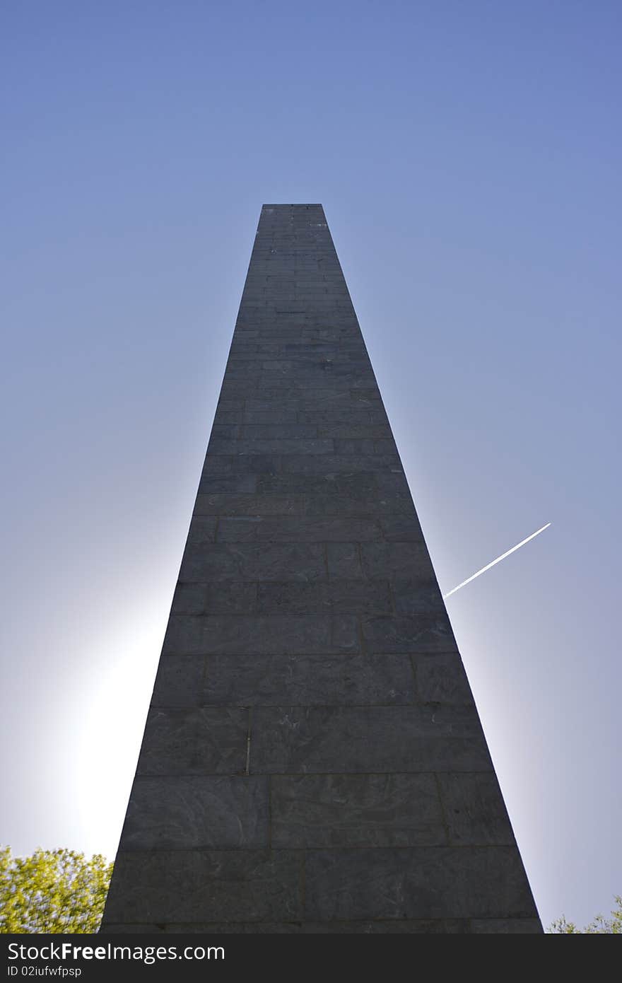 A Union Civil War Monument stands in bright sunlight with a blue sky and jet contrail. This monument is located in Harrisburg, PA near Lake Park. A Union Civil War Monument stands in bright sunlight with a blue sky and jet contrail. This monument is located in Harrisburg, PA near Lake Park.