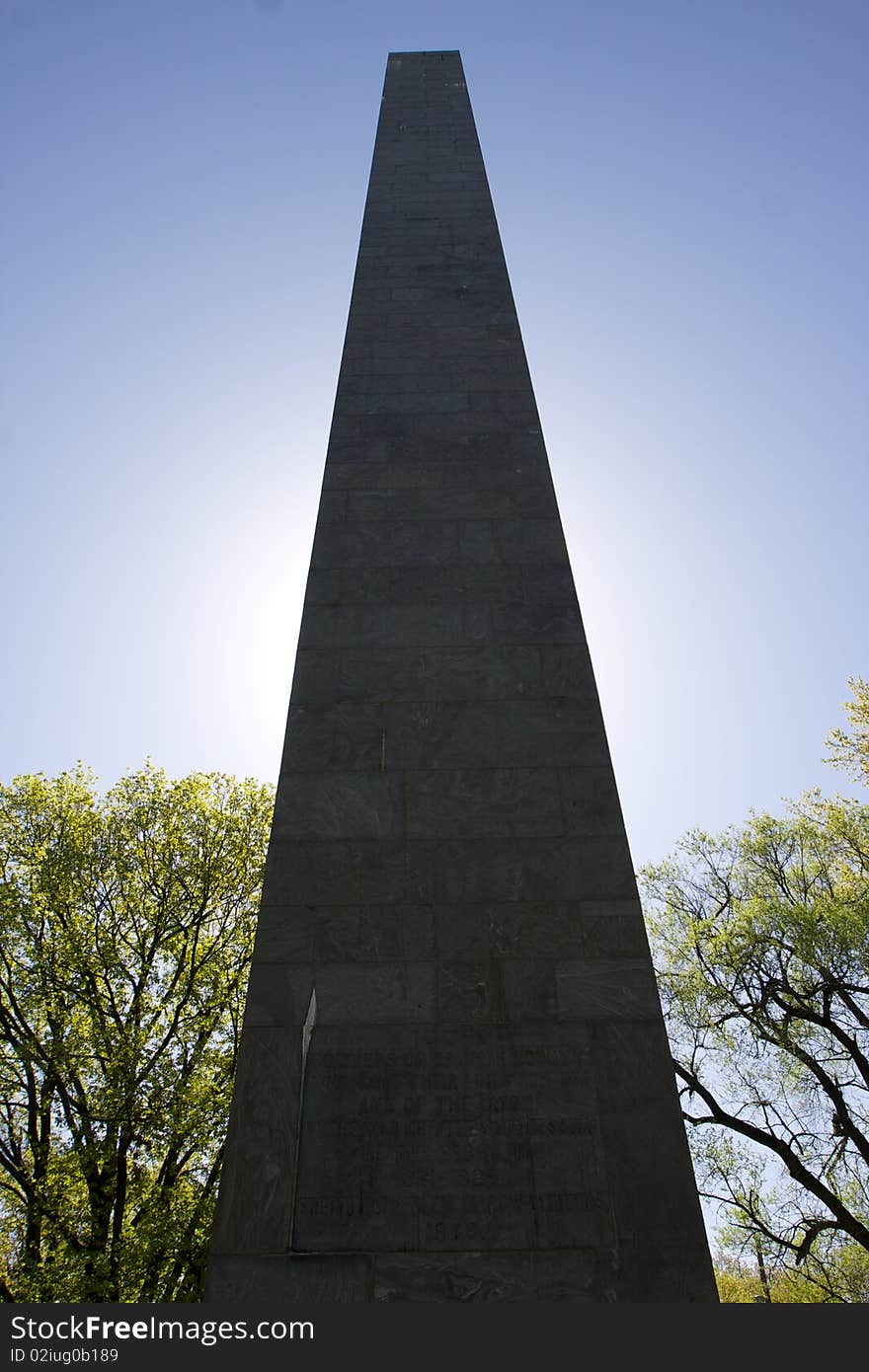 A monument stands in the sunlight surrounded by trees and a blue sky. This monument is a Union Civil War Mounment located in Harrisburg, PA. A monument stands in the sunlight surrounded by trees and a blue sky. This monument is a Union Civil War Mounment located in Harrisburg, PA.