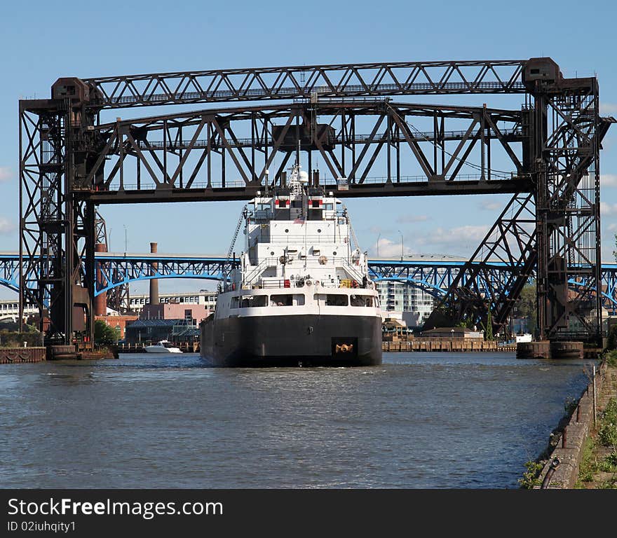 Ship going under a raised railroad bridge. Ship going under a raised railroad bridge