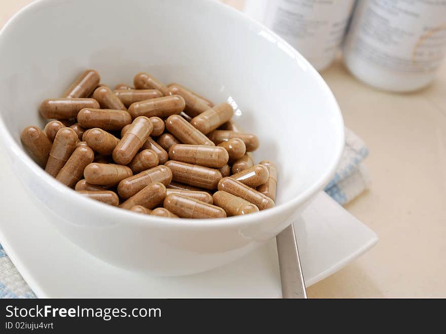 Bowl of medical capsules