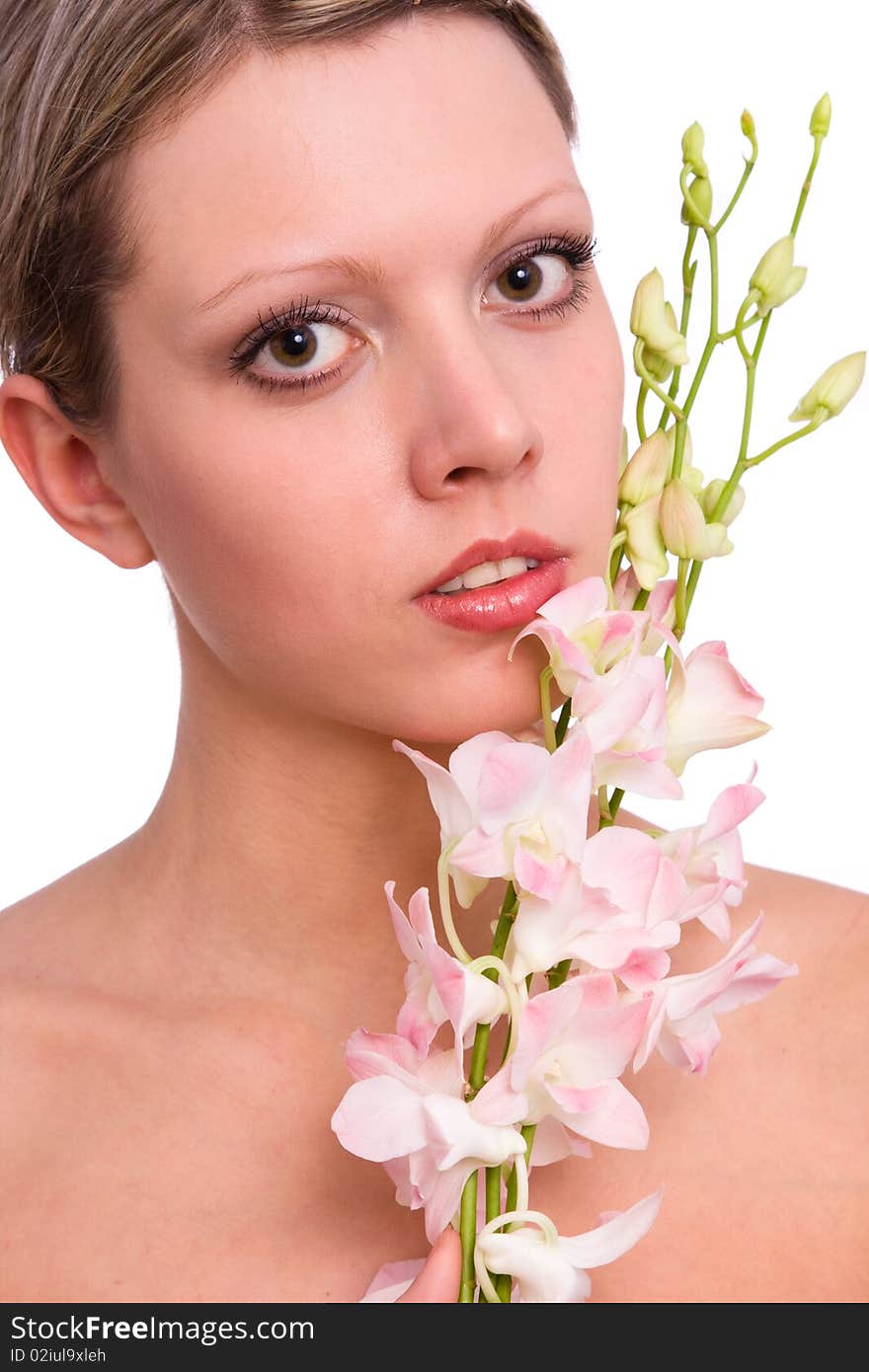 Pretty young woman portrait with orchid