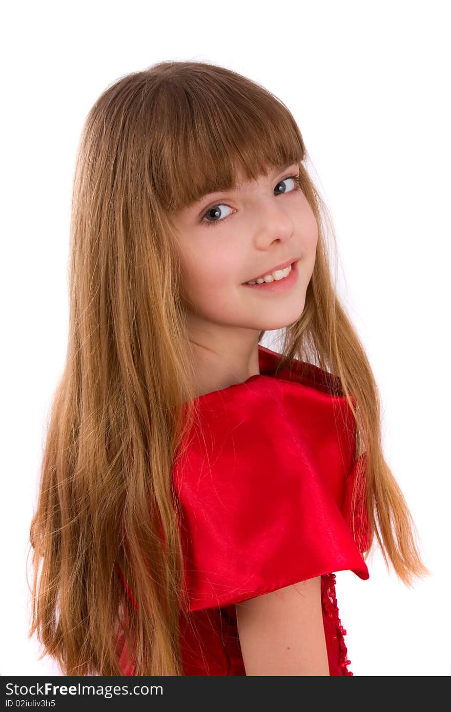 Close-up portrait of a beautiful blond girl. Little girl is wearing in red dress.