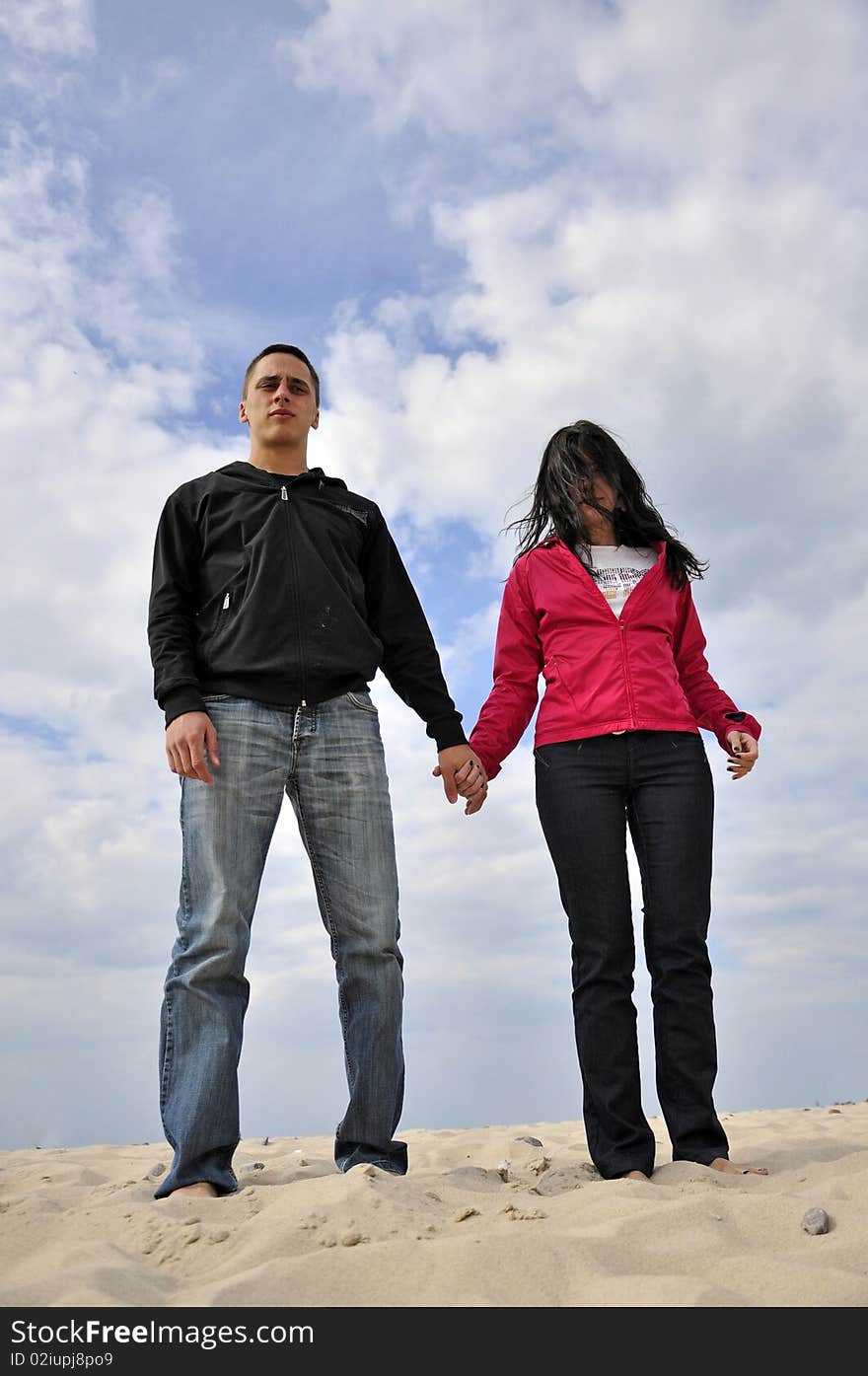 An image showing young girl and boy on the beach. An image showing young girl and boy on the beach