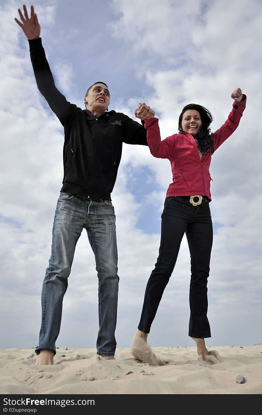 An image showing young girl and boy on the beach. An image showing young girl and boy on the beach