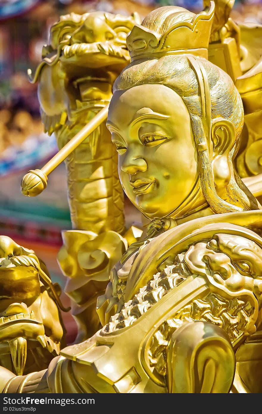 God gold in front of a Chinese temple. God gold in front of a Chinese temple.