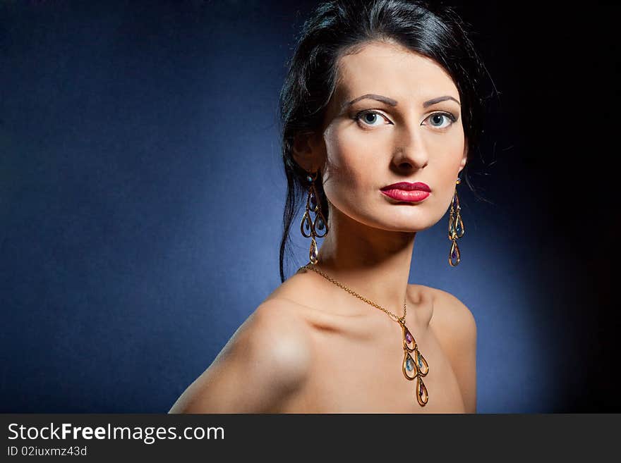 Portrait of elegant beautiful woman wearing jewelry.