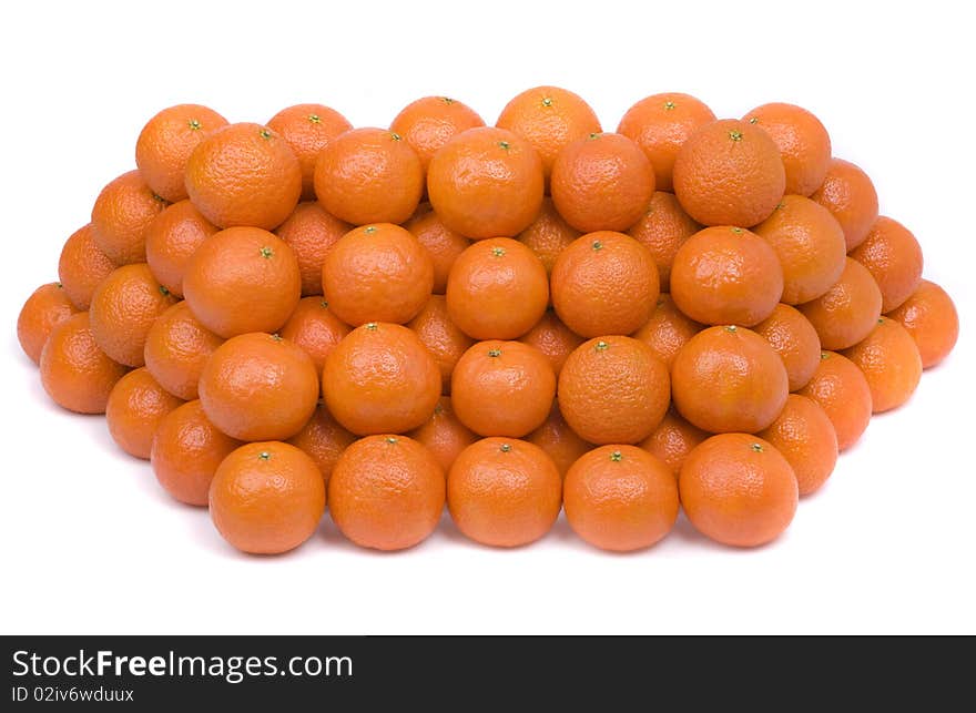 Pyramid from tangerines on a white background.