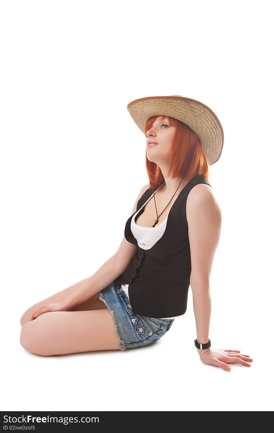 Beautiful red girl in a cowboy's hat. Beautiful red girl in a cowboy's hat