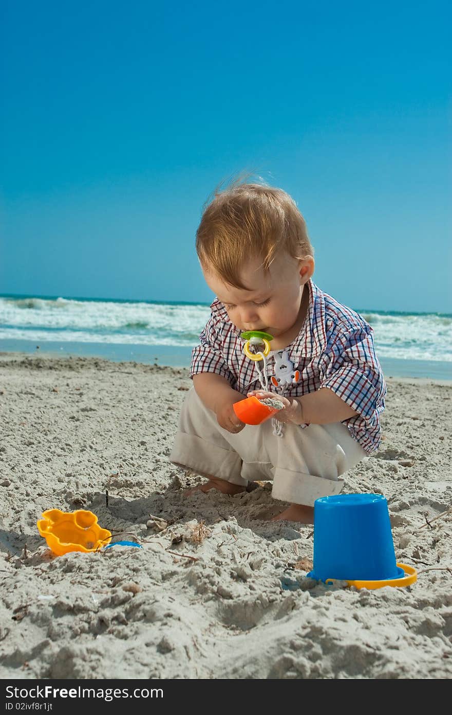 Child playing on a beach. Child playing on a beach