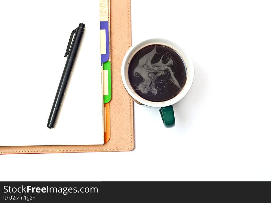 Coffee, pen and  notepad