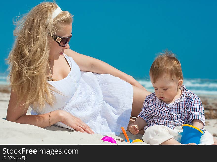 Child and mother on a beach. Child and mother on a beach