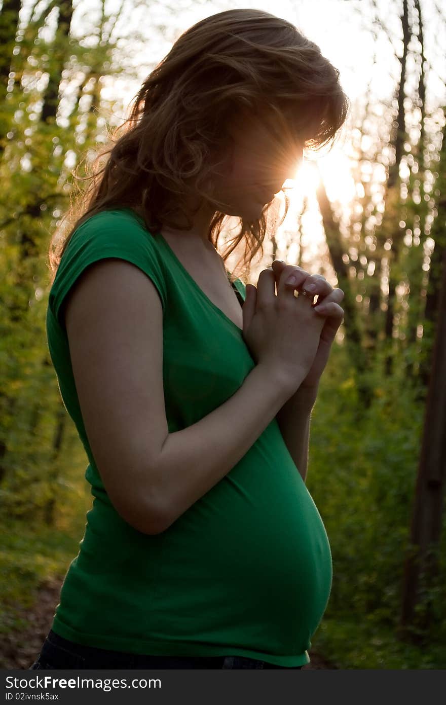 Young Pregnant Woman Is Praying