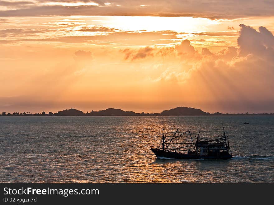 Sunrise on the east sea of Thailand which a boat is sailing pass. Sunrise on the east sea of Thailand which a boat is sailing pass