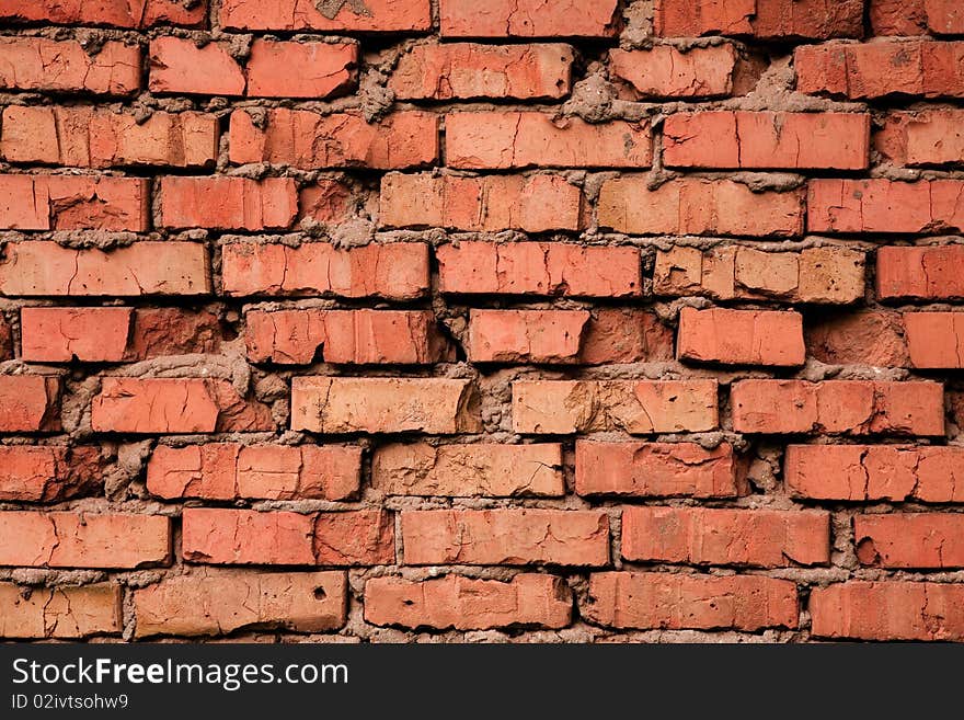 Grungy cracked old red brick texture, natural light. Grungy cracked old red brick texture, natural light