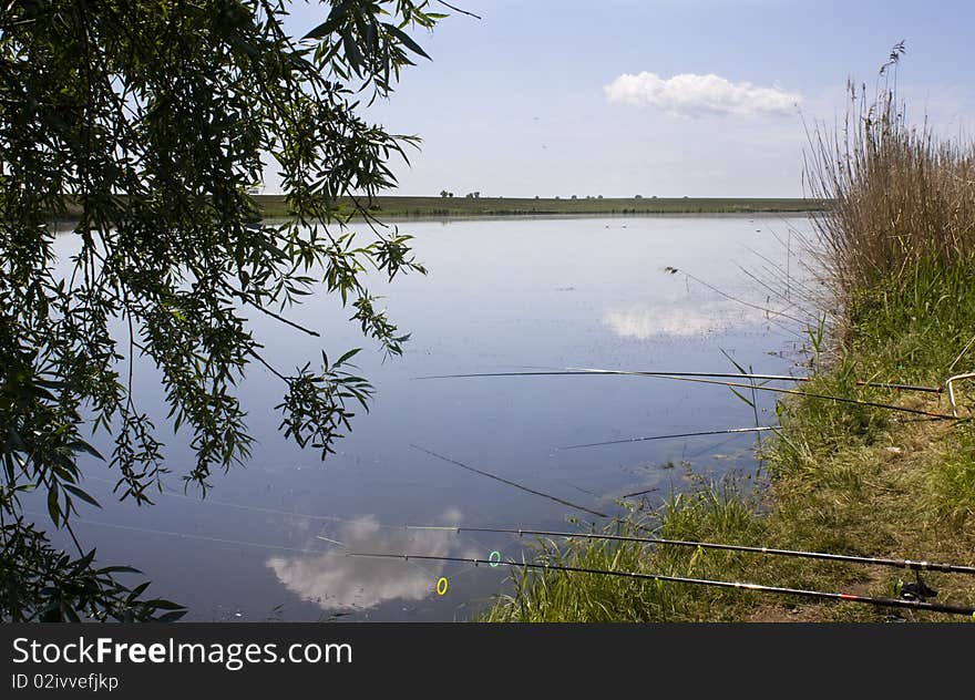 Fishing lake and poles ready to fish