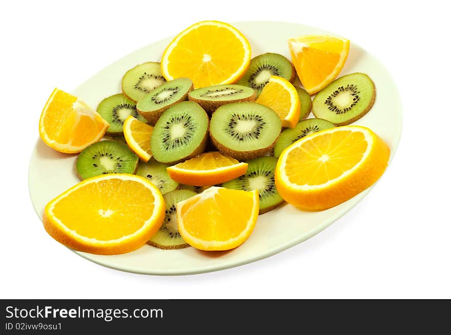 Slices of kiwi and orange on the plate isolated on the white. Slices of kiwi and orange on the plate isolated on the white