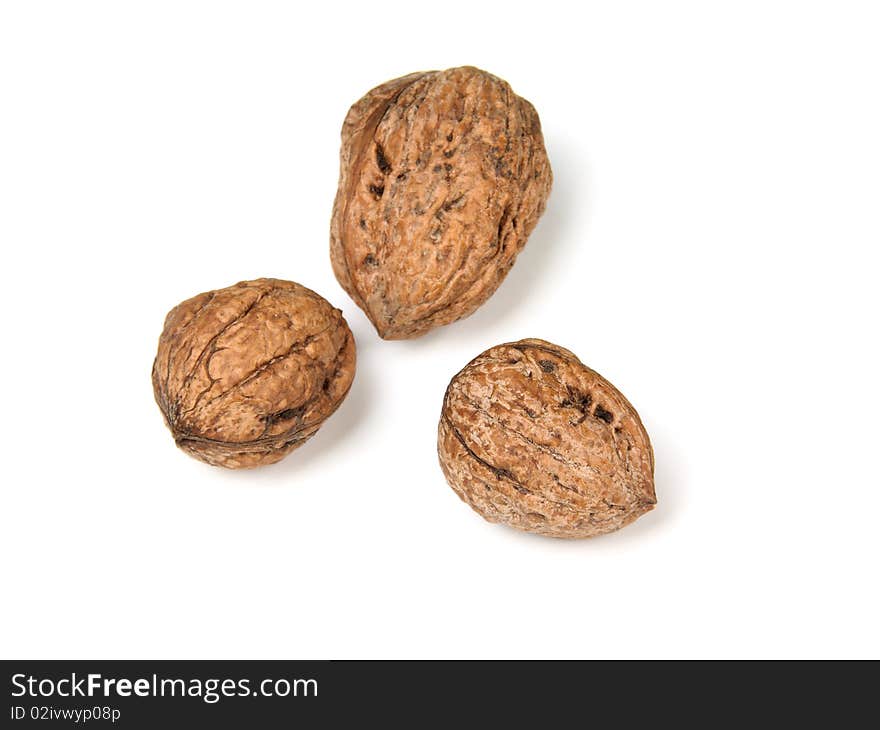 Raw walnuts isolated against white background. Raw walnuts isolated against white background