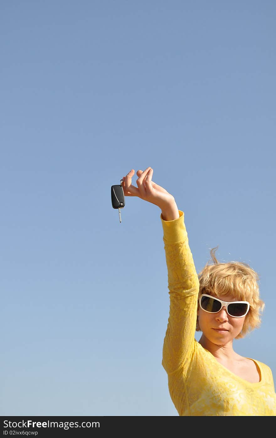 Woman With Keys And White Sunglasses