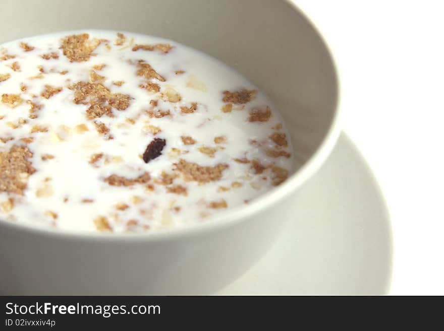 Plate with flakes and milk isolated on white. Plate with flakes and milk isolated on white