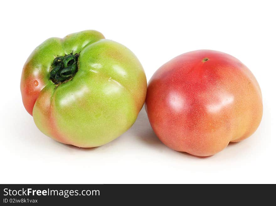 Two tomato isolated on white background