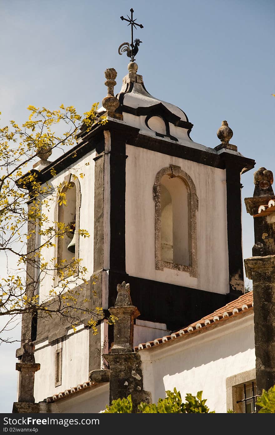 View of the top section of most churches, that include a bell tower.