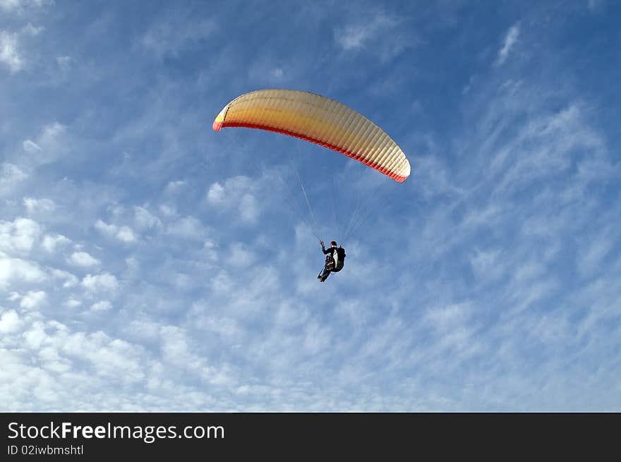 Paraglider on blue sky