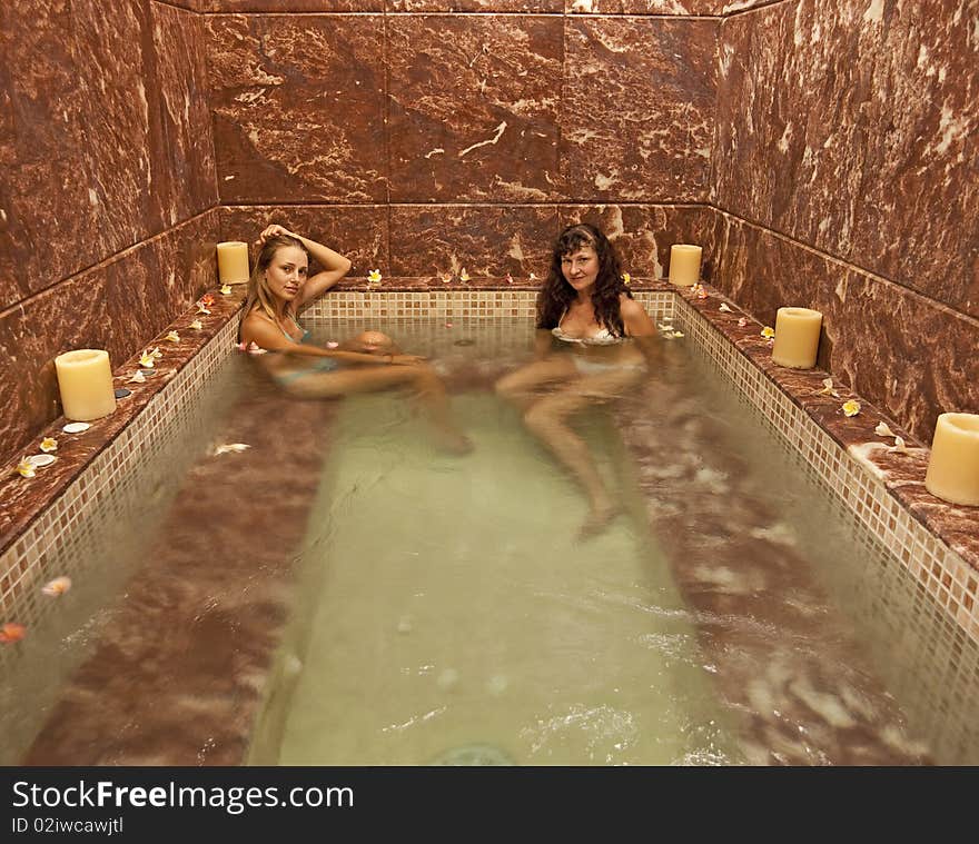 Two young girls in a jacuzzi at a health spa. Two young girls in a jacuzzi at a health spa