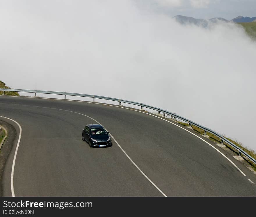 Lonely car on a mountain road