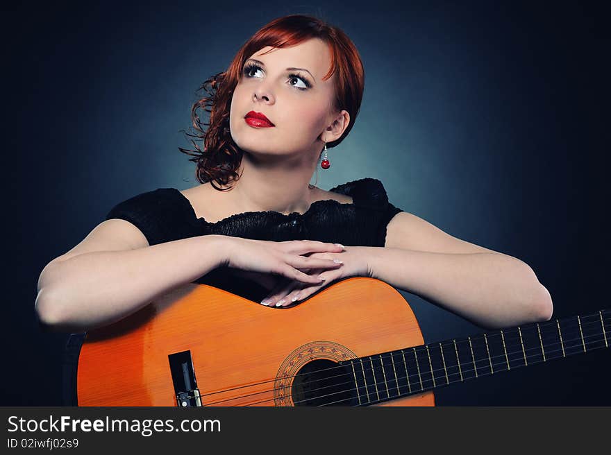 Redhead Woman With Guitar