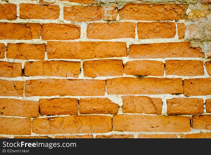 Red brick wall with concrete