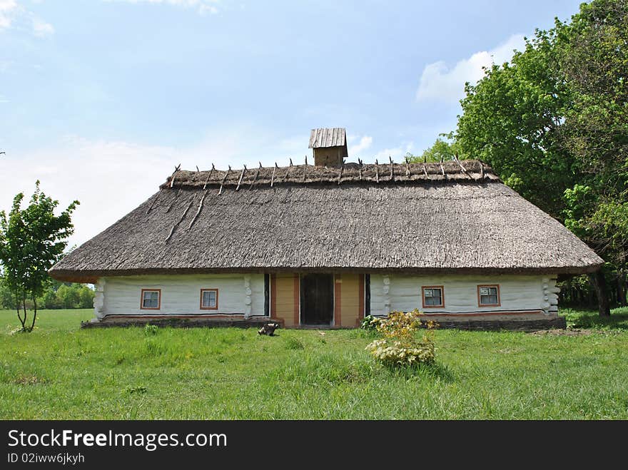 Old clay country house with straw roof