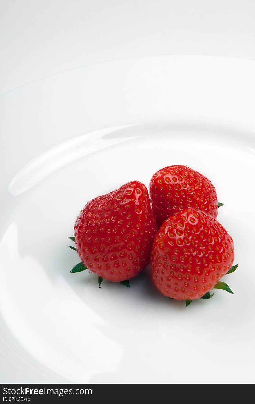 Strawberry on a white plate