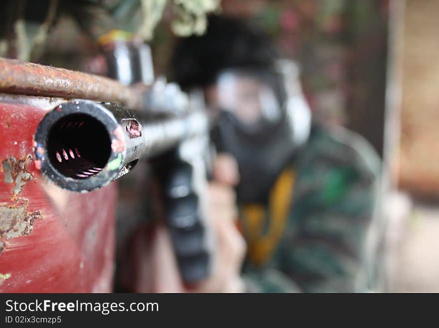 A paintball game war entertainment sports the person gun. A paintball game war entertainment sports the person gun