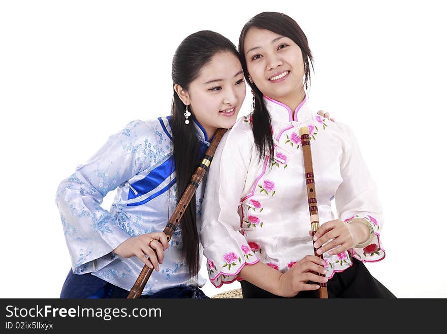 Two Chinese musicians with bamboo flute smiling on white. Two Chinese musicians with bamboo flute smiling on white.