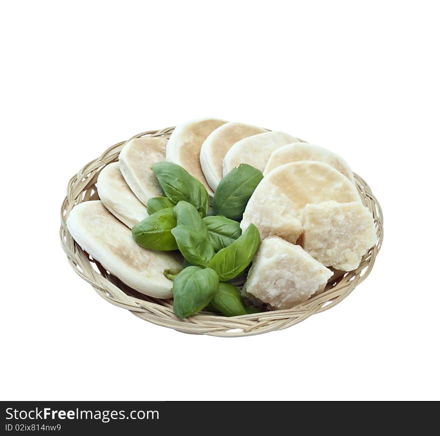 Small basket with bread, basil and parmesan