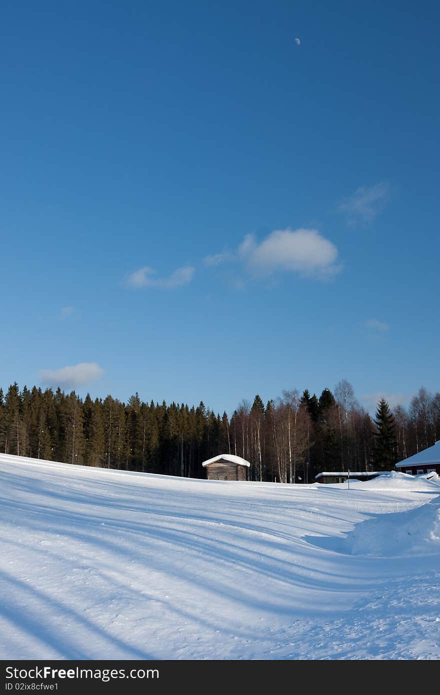 Small wooden house in winter.