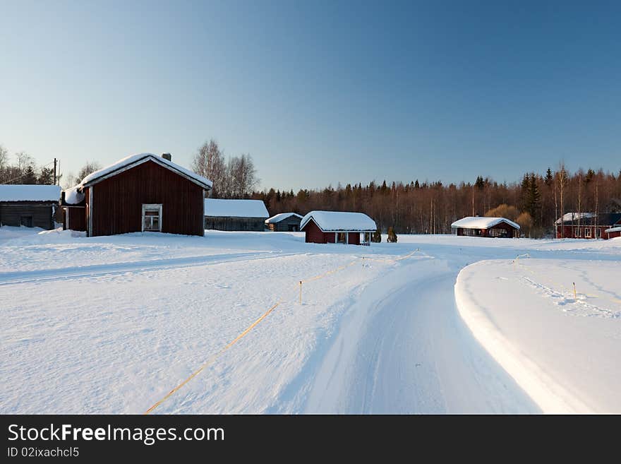 Small wooden houses in winter. Finland.