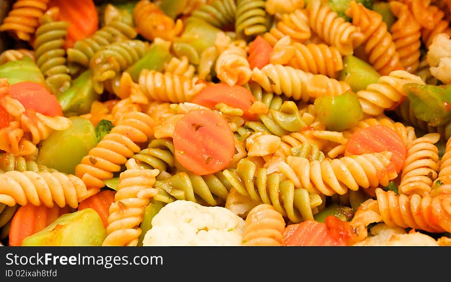 Close up of pasta and vegetable dinner with marinara sauce. Close up of pasta and vegetable dinner with marinara sauce