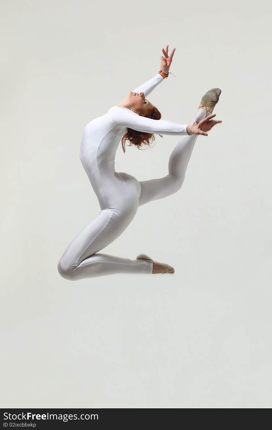 Modern style dancer posing on studio background. Modern style dancer posing on studio background