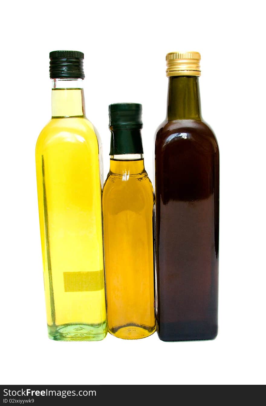 Three colored glass bottles on a white background. Three colored glass bottles on a white background