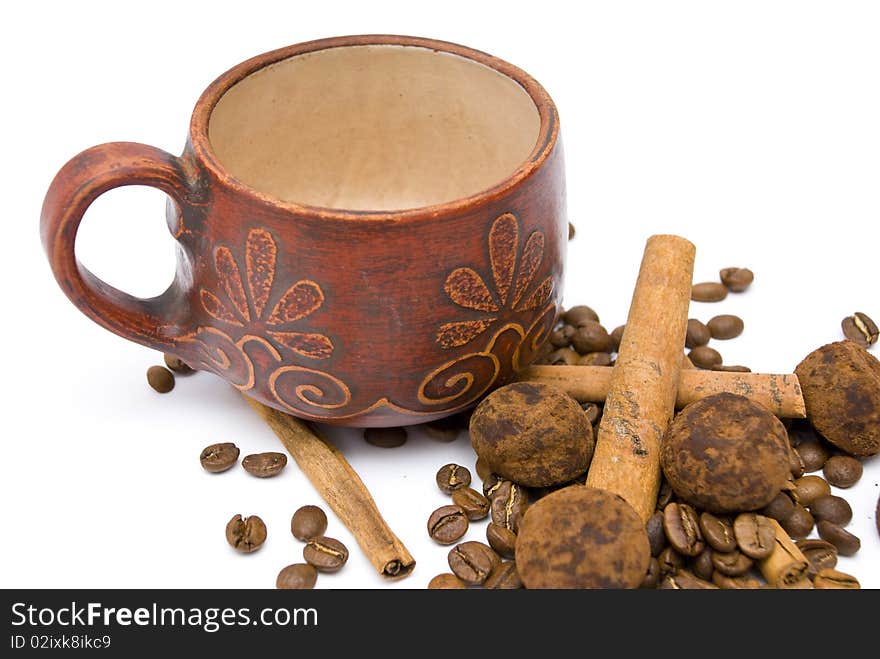 Cup and coffee beans on the white background