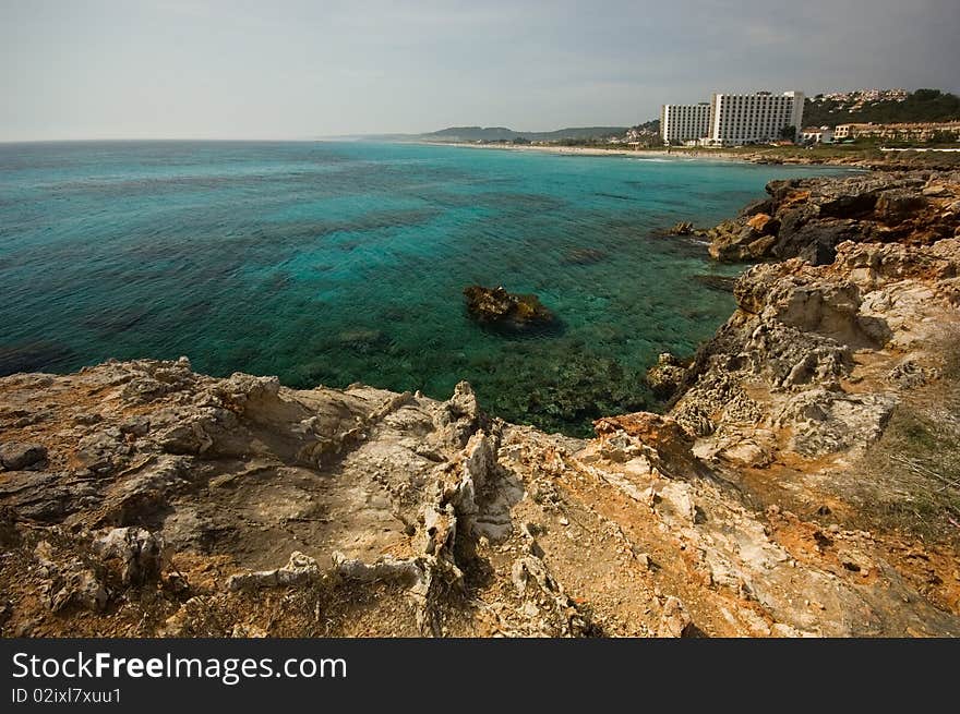 Rugged coastline taken on the Balearic island of Menorca. Shot at wide angle and with a polariser filter. Rugged coastline taken on the Balearic island of Menorca. Shot at wide angle and with a polariser filter.