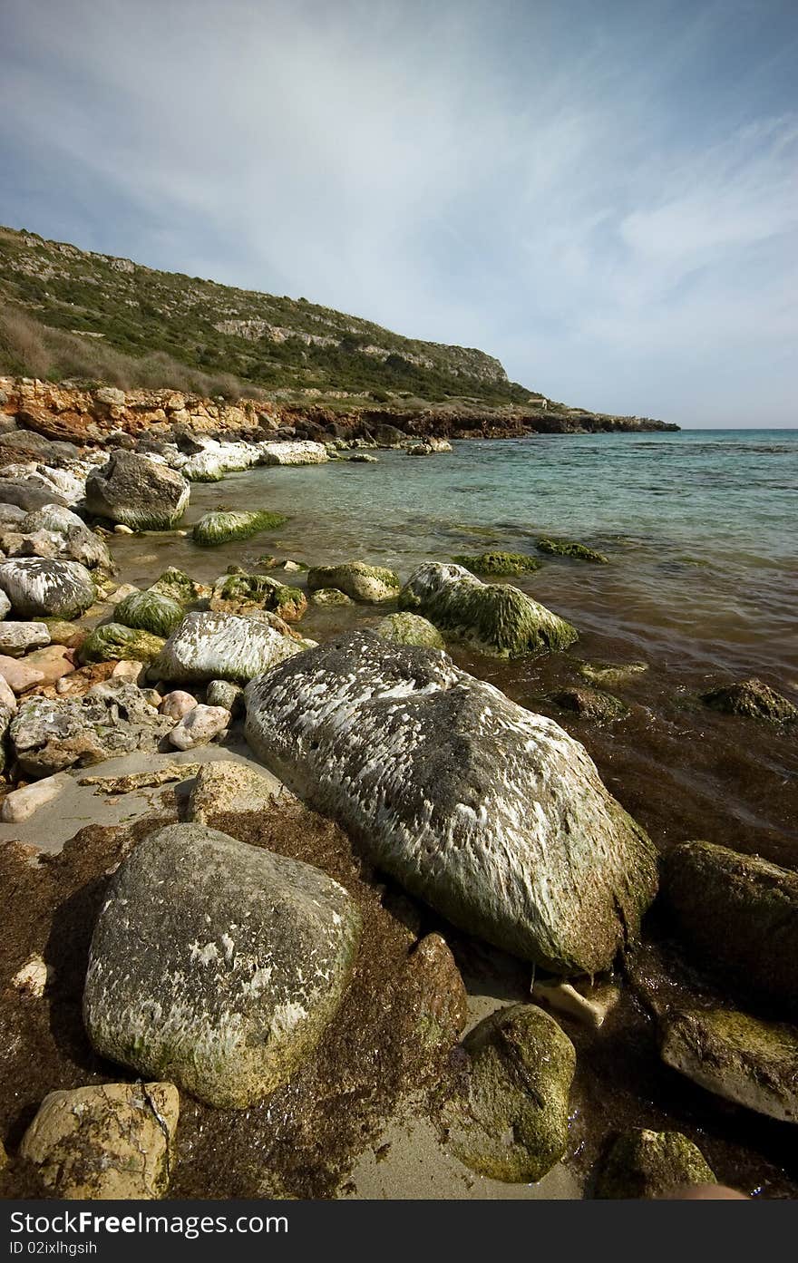 Rugged coastline taken on the Balearic island of Menorca. Shot at wide angle and with a polariser filter. Rugged coastline taken on the Balearic island of Menorca. Shot at wide angle and with a polariser filter.