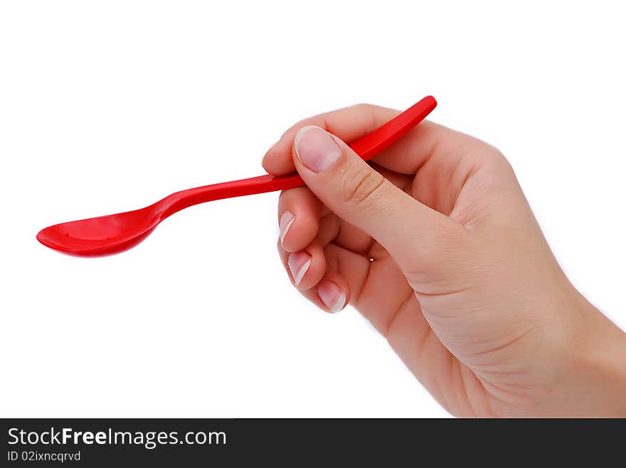 Spoon to feed a child in hand. Spoon to feed a child in hand