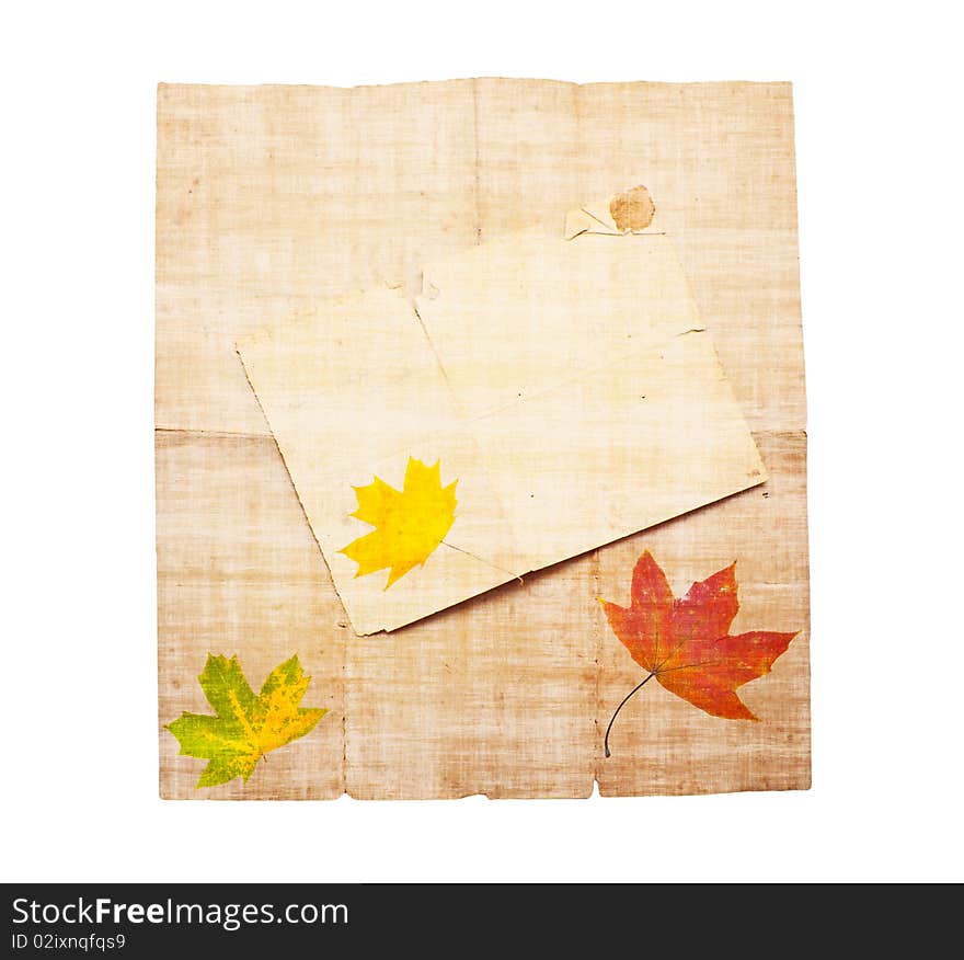 Old dirty paper with autumn leaves