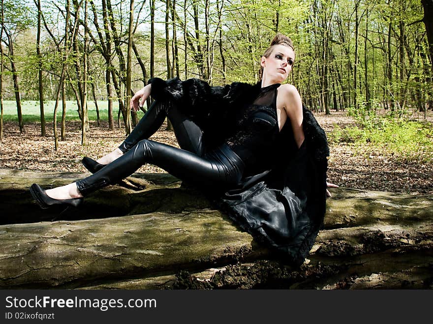 Portrait of beautiful fashion young woman and man in outdoor setting